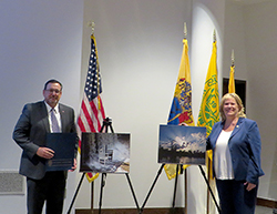 DRBC Exec. Dir. Steve Tambini and N.J.Assemblywoman Carol Murphy pose with the winning photos. Photo by DRBC.